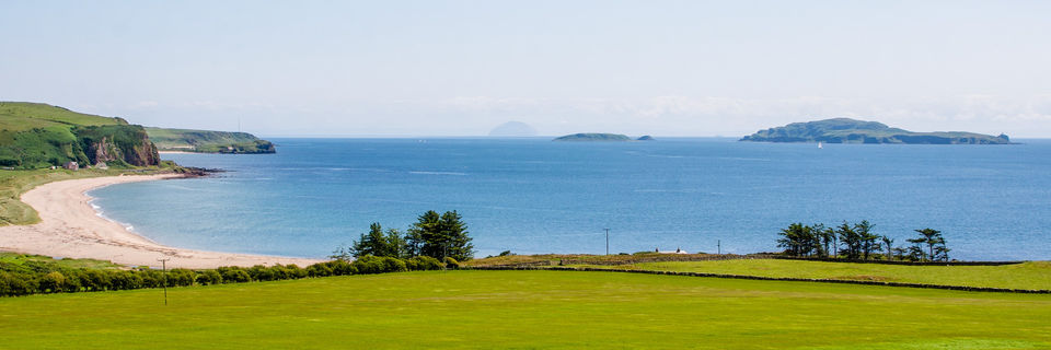 view of sanda island and ailsa craig across carskiey bas